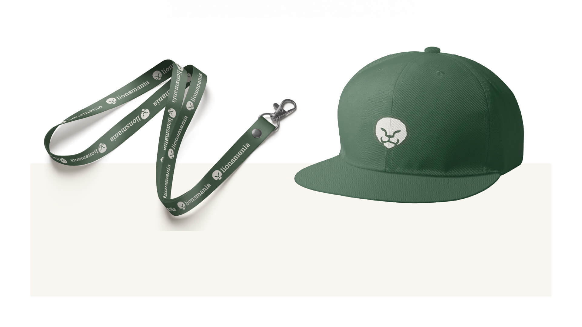 Logo von lionsmania auf einem Lanyard und einer Cap